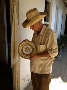 Uncle Tiki examines a family heirloom, 2013